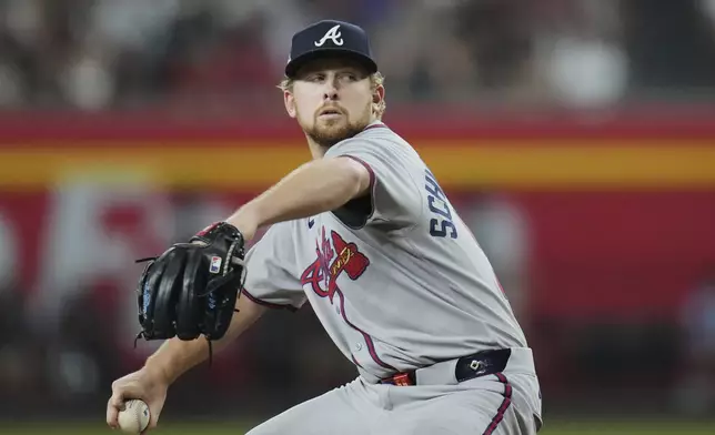 Atlanta Braves starting pitcher Spencer Schwellenbach throws against the Arizona Diamondbacks during the first inning of a baseball game Sunday, April 27, 2025, in Phoenix. (AP Photo/Ross D. Franklin)