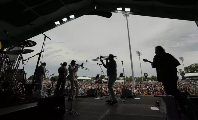 FILE - Bonerama performs at the New Orleans Jazz &amp; Heritage Festival in New Orleans, Friday, May 3, 2024. (AP Photo/Gerald Herbert, File)