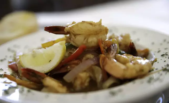 FILE - A classic serving of shrimp creole is served at Cafe Dauphine in New Orleans, Wednesday, Aug. 26, 2015. (AP Photo/Gerald Herbert, File)