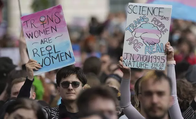 Campaigners take part in a rally organised by trans rights groups, trade unions, and community organisations following the Supreme Court ruling on the definition of a woman in equalities law, at Parliament Square, central London, Saturday April 19, 2025. (AP Photo/Alastair Grant)