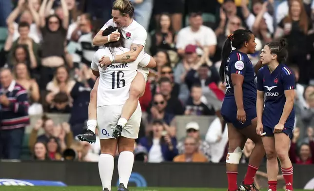 England's Amy Cokayne, left, celebrates following the Women's Six Nations rugby union match at Twickenham stadium in London, Saturday, April 26, 2025. (AP Photo/Alastair Grant)