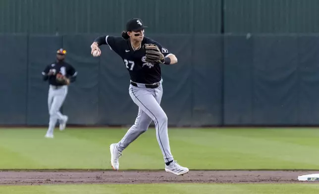 Chicago White Sox outfielder Brooks Baldwin (27) throws to first base for an out during the first inning of a baseball game against the Athletics, Sunday, April 27, 2025, in West Sacramento, Calif. (AP Photo/Sara Nevis)