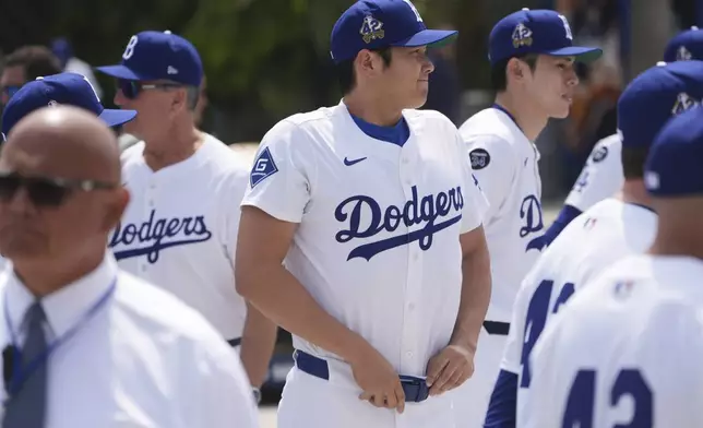 Los Angeles Dodgers' Shohei Ohtani attends an event to commemorate Jackie Robinson Day before a baseball game against the Colorado Rockies Tuesday, April 15, 2025, in Los Angeles. (AP Photo/Damian Dovarganes)