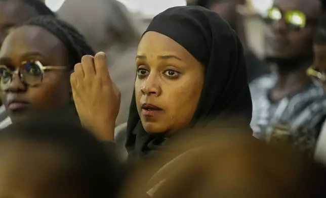 A woman cries during a funeral ceremony for Nigerian Ladi Anzaki Olubunmi, a TikTok content moderator employed by subcontractor Teleperformance, at Chiromo Funeral Parlour in Nairobi, Kenya Thursday, April. 17, 2025. (AP Photo/Brian Inganga)