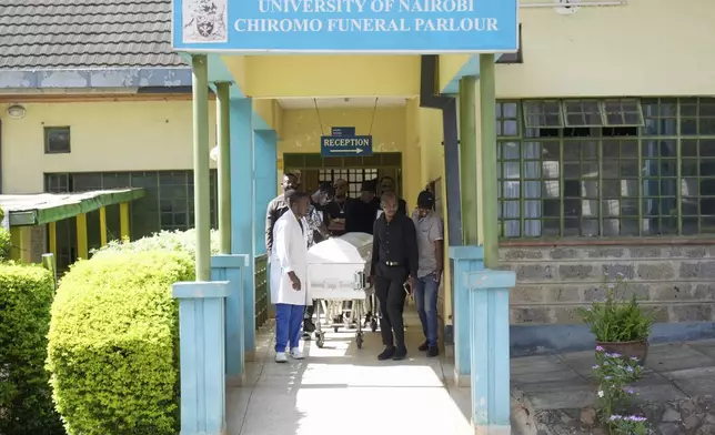 Mourners carry the casket of Nigerian Ladi Anzaki Olubunmi, a TikTok content moderator employed by subcontractor Teleperformance, at Chiromo Funeral Parlour in Nairobi, Kenya Thursday, April. 17, 2025. (AP Photo/Brian Inganga)