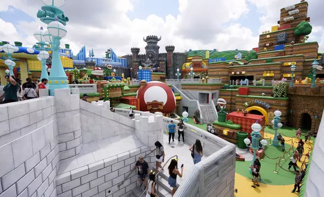 Guests check out the various parts of Super Nintendo World at Epic Universe at Universal Resort Orlando Thursday, April 10, 2025, in Orlando, Fla. (AP Photo/John Raoux)