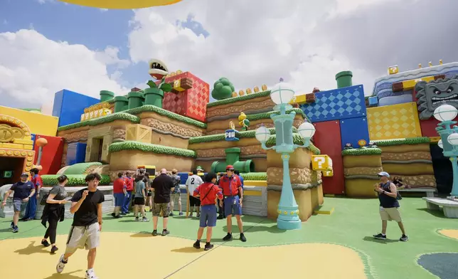 Guests check out the various parts of Super Nintendo World at Epic Universe at Universal Resort Orlando Thursday, April 10, 2025, in Orlando, Fla. (AP Photo/John Raoux)