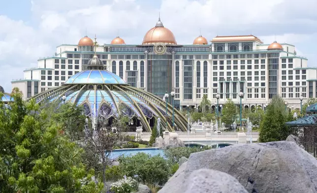 The Universal Helios Grand Hotel overlooking Celestial Park at Epic Universe Theme Park is seen at Universal Resort Orlando Thursday, April 10, 2025, in Orlando, Fla. (AP Photo/John Raoux)