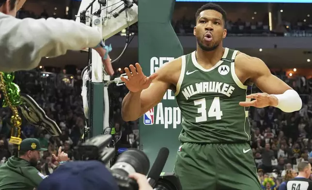 Milwaukee Bucks forward Giannis Antetokounmpo reacts after scoring a basket during the first half in Game 3 of an NBA basketball first-round playoff series against the Indiana Pacers, Friday, April 25, 2025, in Milwaukee. (AP Photo/Nam Y. Huh)
