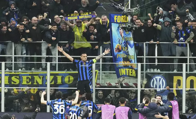 Inter Milan's Lautaro Martinez celebrates after scoring his side's opening goal during the Champions League quarterfinal second leg soccer match between Inter Milan and Bayern Munich at the San Siro stadium in Milan, Italy, Wednesday, April 16, 2025. (AP Photo/Antonio Calanni)
