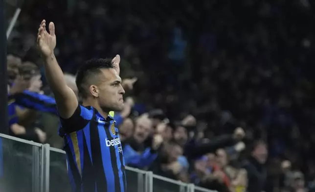 Inter Milan's Lautaro Martinez celebrates after scoring his side's opening goal during the Champions League quarterfinal second leg soccer match between Inter Milan and Bayern Munich at the San Siro stadium in Milan, Italy, Wednesday, April 16, 2025. (AP Photo/Luca Bruno)