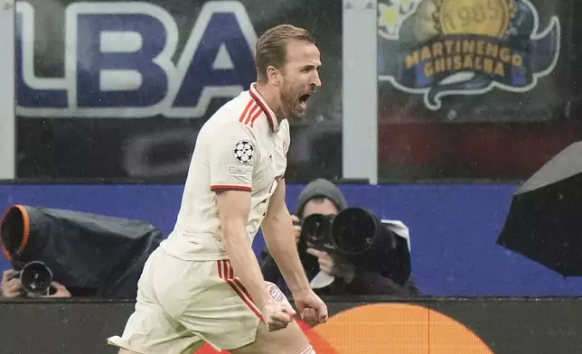 Bayern's Harry Kane celebrates after scoring his side's opening goal during the Champions League quarterfinal second leg soccer match between Inter Milan and Bayern Munich at the San Siro stadium in Milan, Italy, Wednesday, April 16, 2025. (AP Photo/Luca Bruno)