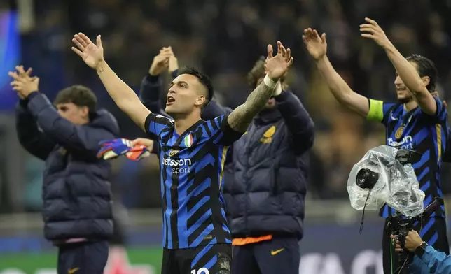 Inter Milan players celebrate at the end of the Champions League quarterfinal second leg soccer match between Inter Milan and Bayern Munich at the San Siro stadium in Milan, Italy, Wednesday, April 16, 2025. (AP Photo/Luca Bruno)