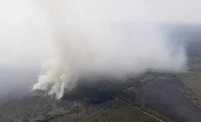 Smoke fills the air from a wildfire in Ocean County, N.J. on Thursday, April 24, 2025. (WPVI-TV via AP)