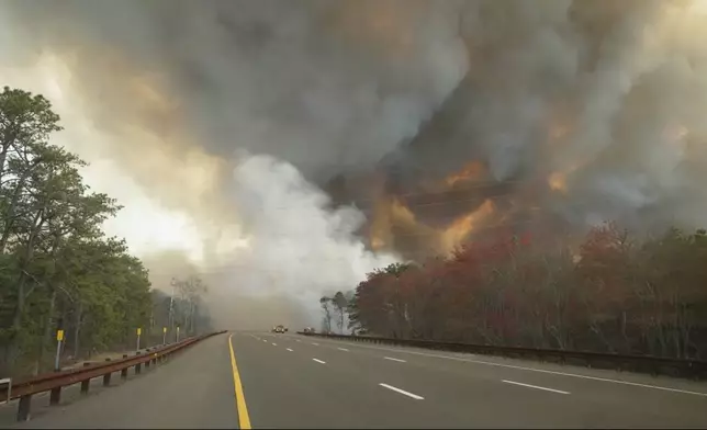 Smoke fills the sky from a wildfire in Lacey Townships, N.J. on Tuesday, April 22, 2025. (New Jersey Department of Environmental Protection via AP)