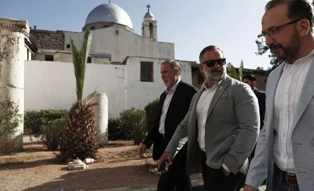 Accompanied by unidentified members of the delegation, U.S. congressman Cory Mills (R-FL), second from right, walks in the Old City of Damascus Friday, April 18, 2025. Mills is in Damascus in an unofficial visit organized by a Syrian-American nonprofit, the first visit by U.S. legislators since the fall of former Syrian President Bashar Assad in December.(AP Photo/Omar Sanadiki)