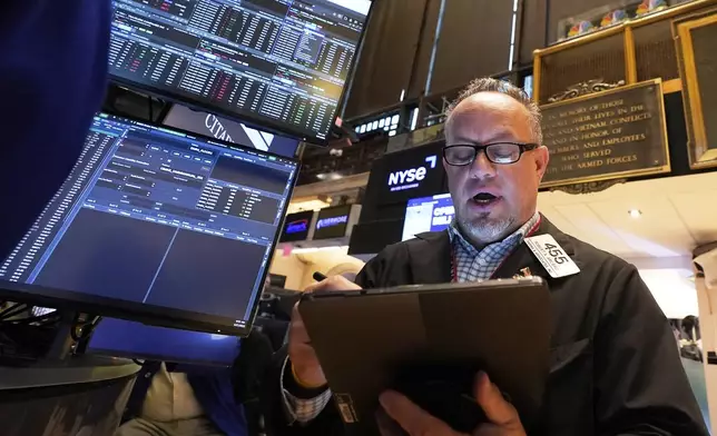 Trader Robert Arciero works on the floor of the New York Stock Exchange, Monday, April 21, 2025. (AP Photo/Richard Drew)