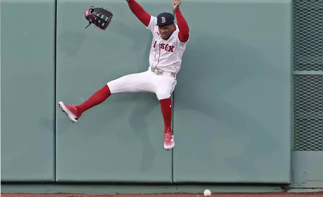 Boston Red Sox center fielder Ceddanne Rafaela cannot catch an eighth-inning double off the wall hit by Toronto Blue Jays' George Springer during a baseball game Thursday, April 10, 2025, in Boston. (AP Photo/Jim Davis)