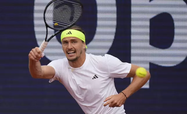 Germany's Alexander Zverev returns the ball to Ben Shelton of the US during the men's final tennis match at the ATP Tour in Munich, Germany, Sunday, April 20, 2025. (AP Photo/Matthias Schrader)