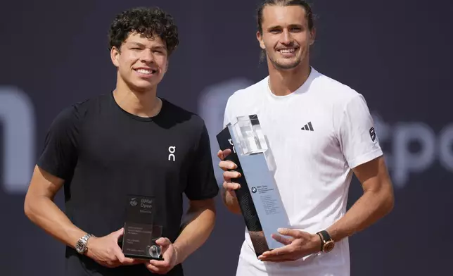 Winner Germany's Alexander Zverev, right, and second placed Ben Shelton of the US pose after the final match at the ATP Tour in Munich, Germany, Sunday, April 20, 2025. (AP Photo/Matthias Schrader)