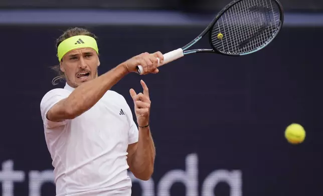 Germany's Alexander Zverev returns the ball to Ben Shelton of the US during the men's final tennis match at the ATP Tour in Munich, Germany, Sunday, April 20, 2025. (AP Photo/Matthias Schrader)