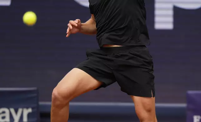 Ben Shelton of the US returns the ball to Germany's Alexander Zverev during the men's final tennis match at the ATP Tour in Munich, Germany, Sunday, April 20, 2025. (AP Photo/Matthias Schrader)