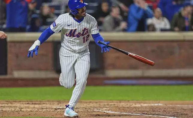 New York Mets' Francisco Lindor (12) reacts as he runs the bases after hitting a three-run home run during the seventh inning of a baseball game against the Philadelphia Phillies Monday, April 21, 2025, in New York. (AP Photo/Frank Franklin II)