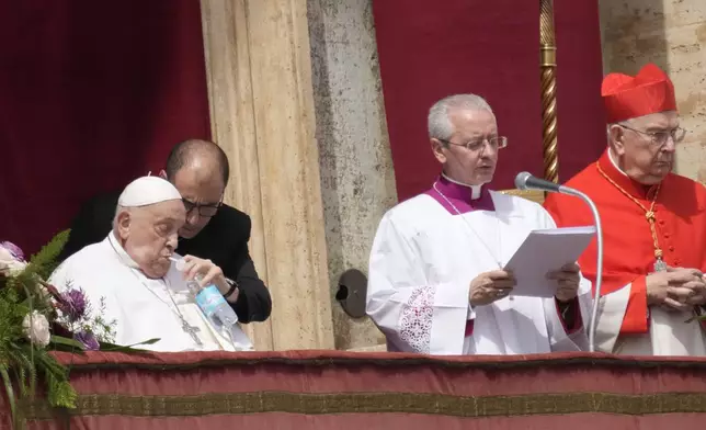 Pope Francis, left, sips water as he appears at the central lodge of St. Peter's Basilica to bestow the Urbi et Orbi (Latin for to the city and to the world) blessing at the end of the Easter mass presided over by Cardinal Angelo Comastri in St. Peter's Square at the Vatican Sunday, April 20, 2025. (AP Photo/Gregorio Borgia)