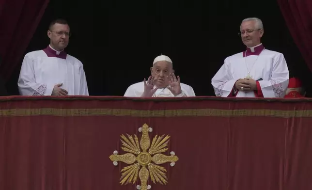 Pope Francis appears on the central lodge of St. Peter's Basilica to bestow the Urbi et Orbi (Latin for to the city and to the world) blessing at the end of the Easter mass presided over by Cardinal Angelo Comastri in St. Peter's Square at the Vatican Sunday, April 20, 2025.(AP Photo/Andrew Medichini)