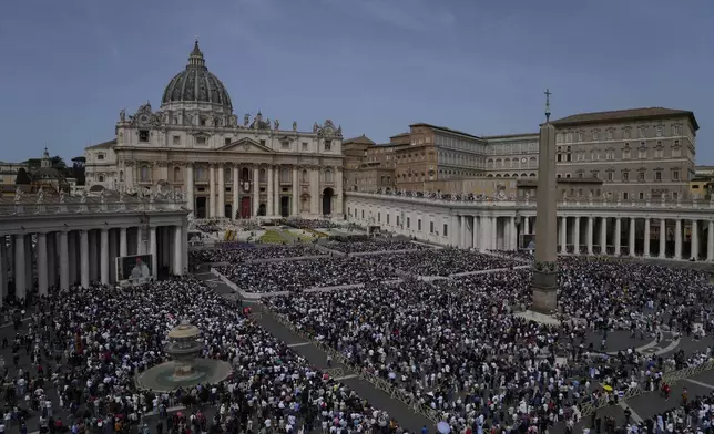 Faithful attend the Easter mass presided over by Cardinal Angelo Comastri in St. Peter's Square at the Vatican Sunday, April 20, 2025. (AP Photo/Gregorio Borgia)