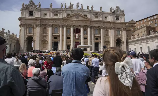 Pope Francis appears on the central lodge of St. Peter's Basilica to bestow the Urbi et Orbi (Latin for to the city and to the world) blessing at the end of the Easter mass presided over by Cardinal Angelo Comastri in St. Peter's Square at the Vatican Sunday, April 20, 2025. (AP Photo/Andrew Medichini)