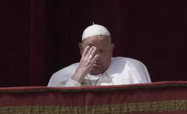 Pope Francis appears on the central lodge of St. Peter's Basilica to bestow the Urbi et Orbi (Latin for to the city and the world) blessing at the end of the Easter mass in St. Peter's Square at the Vatican Sunday, April 20, 2025. (AP Photo/Andrew Medichini)