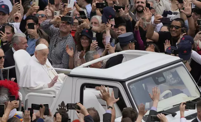 Pope Francis tours the crowd at the end of the Easter mass in St. Peter's Square at the Vatican Sunday, April 20, 2025. Francis died Monday, April 21, 2025. (AP Photo/Gregorio Borgia)