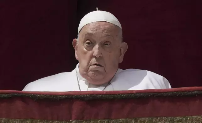 Pope Francis appears on the central lodge of St. Peter's Basilica to bestow the Urbi et Orbi (Latin for to the city and the world) blessing at the end of the Easter mass in St. Peter's Square at the Vatican Sunday, April 20, 2025. (AP Photo/Andrew Medichini)