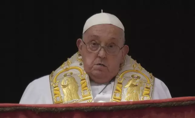 Pope Francis appears on the central lodge of St. Peter's Basilica to bestow the Urbi et Orbi (Latin for to the city and the world) blessing at the end of the Easter mass in St. Peter's Square at the Vatican Sunday, April 20, 2025. (AP Photo/Andrew Medichini)
