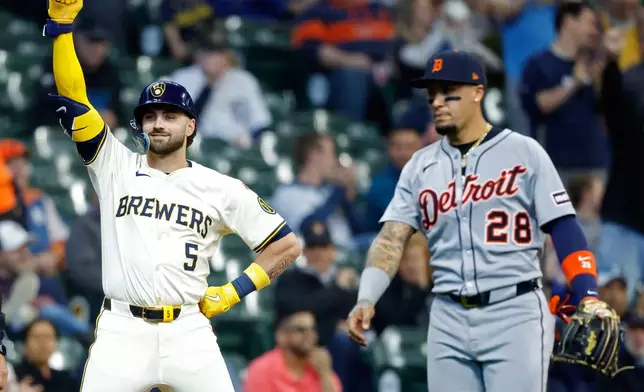 Milwaukee Brewers' Garrett Mitchell (5) reacts after his triple against the Detroit Tigers during the second inning of a baseball game, Wednesday, April 16, 2025, in Milwaukee. (AP Photo/Jeffrey Phelps)