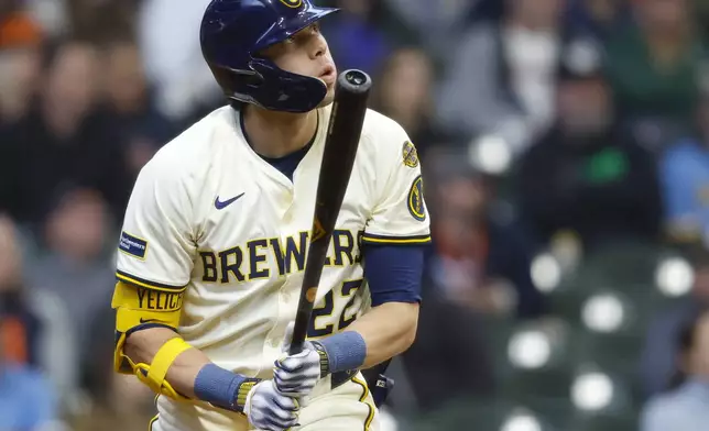 Milwaukee Brewers' Christian Yelich watches his home run against the Detroit Tigers during the third inning of a baseball game, Wednesday, April 16, 2025, in Milwaukee. (AP Photo/Jeffrey Phelps)