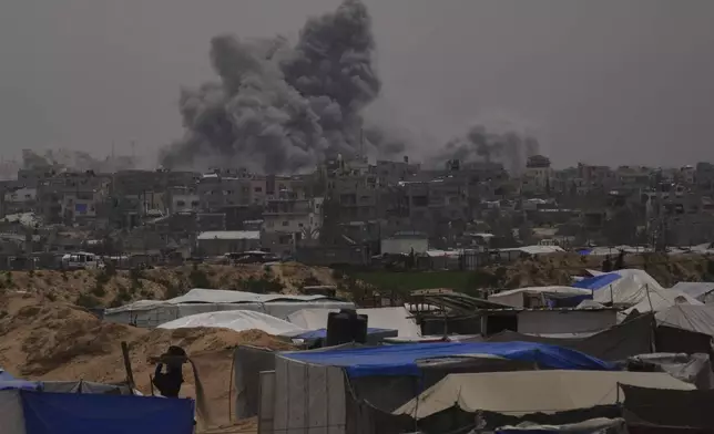 Smoke rises to the sky following an Israeli bombardment in Khan Younis, Gaza Strip, Thursday, April 24, 2025. (AP Photo/Abdel Kareem Hana)