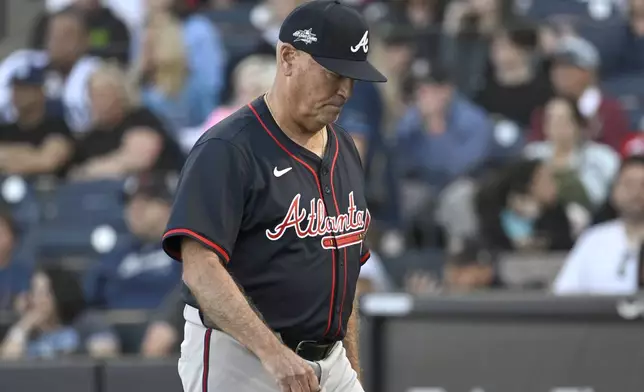 Atlanta Braves manager Brian Snitker heads to the dugout during a baseball game against the Tampa Bay Rays, Saturday, April 12, 2025, in Tampa, Fla. (AP Photo/Jason Behnken)