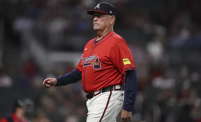 Atlanta Braves manager Brian Snitker (43) looks on after making a pitching change in the seventh inning of a baseball game against the Minnesota Twins, Friday, April 18, 2025, in Atlanta. (AP Photo/Colin Hubbard)