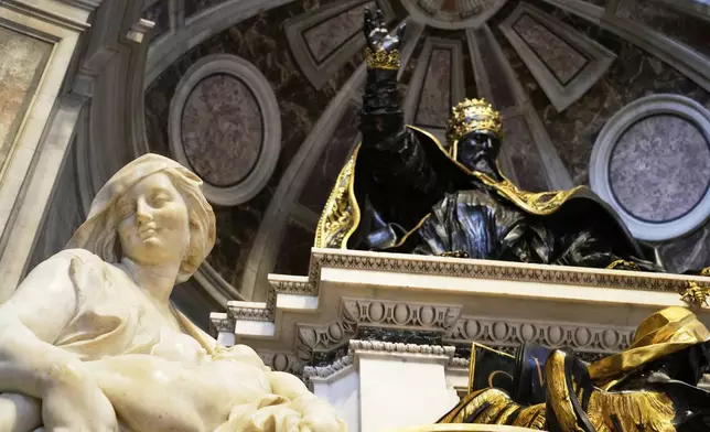 The recent restoration of the funerary monument of Urban VIII is displayed to journalists inside St. Peter's Basilica at the Vatican, Friday, April 11, 2025. (AP Photo/Gregorio Borgia)