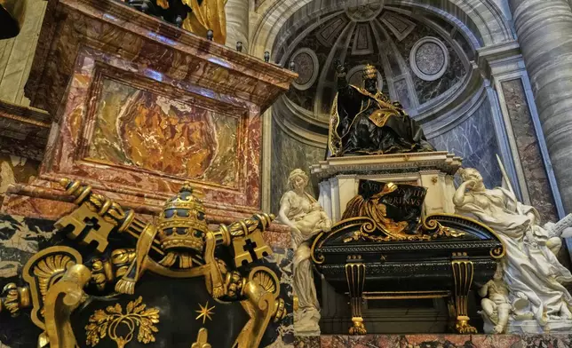 The recent restoration of the funerary monument of Urban VIII is displayed to journalists inside St. Peter's Basilica at the Vatican, Friday, April 11, 2025. (AP Photo/Gregorio Borgia)