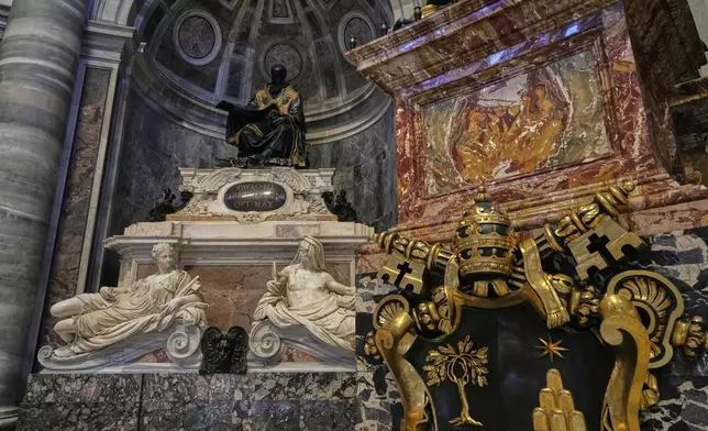 The recent restoration of the funerary monument of Pope Paul III is displayed to journalists inside St. Peter's Basilica at the Vatican, Friday, April 11, 2025. (AP Photo/Gregorio Borgia)