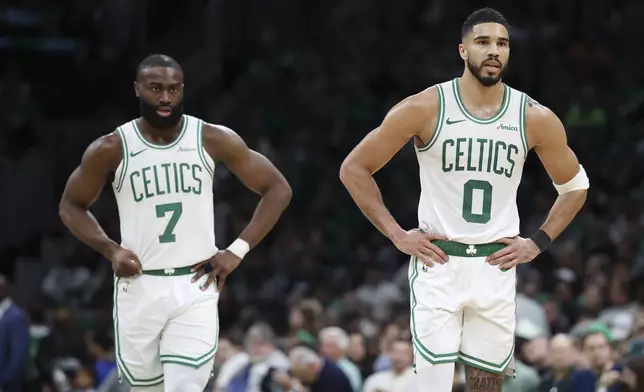 Boston Celtics' Jaylen Brown (7), left, and Jayson Tatum (0) play against the Orlando Magic during the first half in Game 1 of a first-round NBA playoff basketball series Sunday, April 20, 2025, in Boston. (AP Photo/Michael Dwyer)