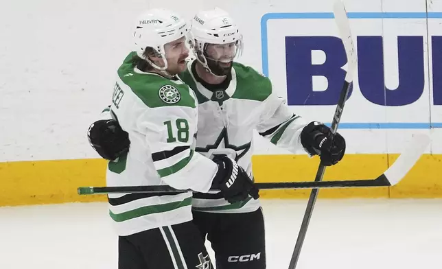 Dallas Stars center Colin Blackwell, right, celebrates his goal with Sam Steel (18) against the Detroit Red Wings in the second period of an NHL hockey game Monday, April 14, 2025, in Detroit. (AP Photo/Paul Sancya)