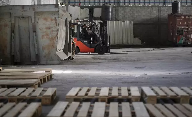 A World Food Program warehouse is seen empty in the Nuseirat refugee camp, Gaza Strip, Saturday April 26, 2025. (AP Photo/Abdel Kareem Hana)