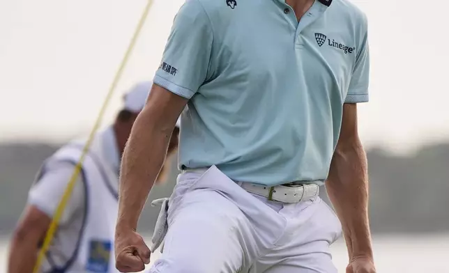 Justin Thomas celebrates after winning the RBC Heritage golf tournament, Sunday, April 20, 2025, in Hilton Head Island, S.C. (AP Photo/Mike Stewart)