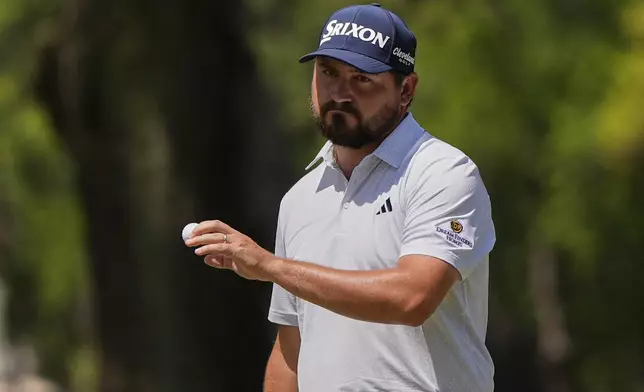 Andrew Novak waves to the gallery after making putt on the second hole during the final round of the RBC Heritage golf tournament, Sunday, April 20, 2025, in Hilton Head Island, S.C. (AP Photo/Mike Stewart)