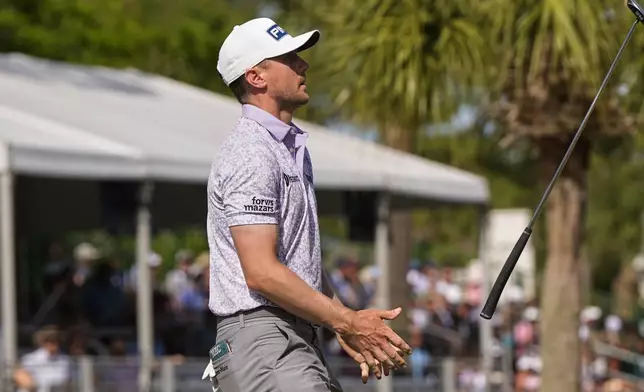 Mackenzie Hughes, of Canada, reacts after missing his putt on the 16th hole during the final round of the RBC Heritage golf tournament, Sunday, April 20, 2025, in Hilton Head Island, S.C. (AP Photo/Mike Stewart)