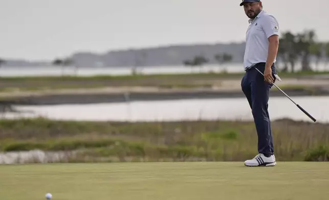 Andrew Novak watches his putt on the 18th hole during a playoff in the final round of the RBC Heritage golf tournament, Sunday, April 20, 2025, in Hilton Head Island, S.C. (AP Photo/Mike Stewart)